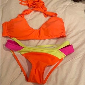 Orange bikini top and multi color bottoms